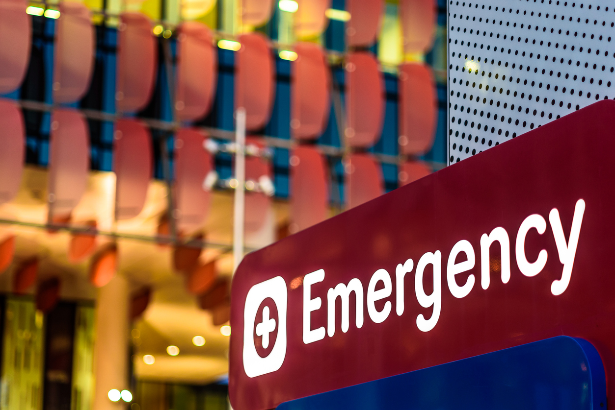 An "Emergency" Sign in front of a hospital in the early evening